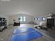 Bright workout room with exercise equipment, yoga mats, and plenty of space at 3601 Bivins Rd, Hillsborough, NC 27278