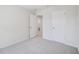 Carpeted bedroom with a doorway leading to the bathroom and another leading out of the room at 3717 Rosebush Dr, Zebulon, NC 27597