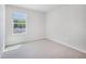 Carpeted bedroom with a window that provides natural light and offers a view of the outdoors at 3717 Rosebush Dr, Zebulon, NC 27597