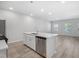 Spacious kitchen features island with sink, dishwasher and quartz countertops at 3717 Rosebush Dr, Zebulon, NC 27597