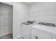 A laundry room featuring a side-by-side washer and dryer and wire rack shelves at 3717 Rosebush Dr, Zebulon, NC 27597