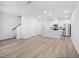 Open-concept living space flows seamlessly into a bright, modern kitchen with stainless steel appliances at 3717 Rosebush Dr, Zebulon, NC 27597