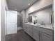 Bathroom with a double sink vanity, modern fixtures, a spacious shower, and neutral color palette at 3719 Rosebush Dr, Zebulon, NC 27597