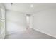 Light-filled bedroom with plush carpeting, a window, and a closet ready for your personal touch at 3825 Rosebush Dr, Zebulon, NC 27597