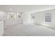 Bright, empty bedroom featuring neutral carpet and several windows for lots of natural light at 3825 Rosebush Dr, Zebulon, NC 27597