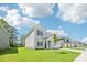 Inviting two-story home with a well-kept lawn and a row of similar houses at 3825 Rosebush Dr, Zebulon, NC 27597