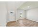 Bright and airy foyer featuring wood-look floors, a window, and a white door at 3825 Rosebush Dr, Zebulon, NC 27597