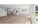 Bright open-concept living room flows into a modern kitchen with stainless steel appliances at 3825 Rosebush Dr, Zebulon, NC 27597