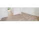Open living area with neutral walls and durable wood-look flooring creating a cohesive design at 3825 Rosebush Dr, Zebulon, NC 27597