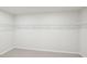 Walk-in closet features wire shelving and neutral carpet at 3825 Rosebush Dr, Zebulon, NC 27597