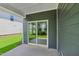 The back porch features a sliding door that leads out to the green backyard at 3829 Rosebush Dr, Zebulon, NC 27597