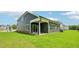 Home's backyard featuring a green lawn and partial view of the covered porch at 3829 Rosebush Dr, Zebulon, NC 27597