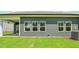 View of the home's backyard and the exterior featuring multiple windows at 3829 Rosebush Dr, Zebulon, NC 27597