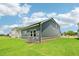 Backyard view showcasing the lawn and home's exterior at 3829 Rosebush Dr, Zebulon, NC 27597