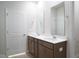Bathroom features a double vanity with a white countertop and brushed metal faucets at 3829 Rosebush Dr, Zebulon, NC 27597