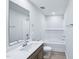 Bright bathroom features a large mirror, white countertop, and tiled shower and bathtub at 3829 Rosebush Dr, Zebulon, NC 27597