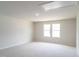 Bedroom with carpet floors and natural light streaming through large windows at 3829 Rosebush Dr, Zebulon, NC 27597