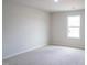 Bedroom with carpet floors and a single window showcasing outside at 3829 Rosebush Dr, Zebulon, NC 27597