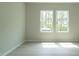 Bedroom with vinyl floors and natural light streaming through large windows at 3829 Rosebush Dr, Zebulon, NC 27597