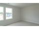 Bedroom with carpet flooring and natural light streaming through the large window at 3829 Rosebush Dr, Zebulon, NC 27597