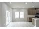 Bright dining area featuring a kitchen nook with an island and sliding glass doors at 3829 Rosebush Dr, Zebulon, NC 27597