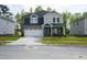 Beautiful two-story home with a two-car garage, neutral colors, and well-maintained lawn at 3829 Rosebush Dr, Zebulon, NC 27597