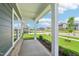 Inviting front porch with white columns and well-maintained landscaping, perfect for enjoying neighborhood views at 3829 Rosebush Dr, Zebulon, NC 27597
