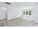 Spacious open-concept living area with large windows and plenty of natural light at 3829 Rosebush Dr, Zebulon, NC 27597