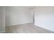 Spacious living area with light walls, base molding, and wood-look flooring at 3829 Rosebush Dr, Zebulon, NC 27597