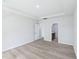 Large bedroom with tray ceilings and doorway into the bathroom at 3829 Rosebush Dr, Zebulon, NC 27597