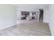 Open concept floor plan with kitchen, and staircase with light wood floors at 3829 Rosebush Dr, Zebulon, NC 27597