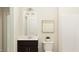 Clean and modern bathroom with a stylish vanity, a framed mirror, and a toilet creating a compact space at 4020 Shadbush St, Raleigh, NC 27616