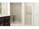 Bathroom featuring a glass-enclosed shower, and a vanity with a light tile flooring at 4020 Shadbush St, Raleigh, NC 27616