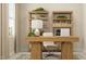 Stylish home office setup with a wooden desk, comfortable chair, and decorative shelves for a productive workspace at 4020 Shadbush St, Raleigh, NC 27616