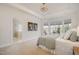 Relaxing main bedroom featuring tray ceilings, large windows, and ensuite bathroom at 404 Regulators Way, Hillsborough, NC 27278