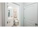 Clean bathroom showcasing a single sink vanity and a toilet with a neutral color palette at 4101 Shadbush St, Raleigh, NC 27616