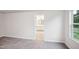 Spacious bedroom with neutral carpeting and a view into the ensuite bathroom at 4101 Shadbush St, Raleigh, NC 27616