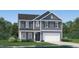 Charming two-story home with gray siding, shutters, and a manicured front yard at 4101 Shadbush St, Raleigh, NC 27616