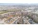 A high aerial view of a community that features various styles of multi-unit housing and roadways at 411 Weather Ridge Ln # 45, Cary, NC 27513