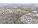 A high aerial of a community featuring various styles of multi-unit housing and green spaces at 411 Weather Ridge Ln # 45, Cary, NC 27513