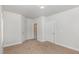 Spacious bedroom with neutral carpet and multiple closets for ample storage at 411 Weather Ridge Ln # 45, Cary, NC 27513