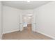 Bedroom with neutral tones, multiple doors, and tan carpeting at 411 Weather Ridge Ln # 45, Cary, NC 27513