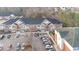 Apartment building featuring brick and siding, balconies, parking lot and professional landscaping at 411 Weather Ridge Ln # 45, Cary, NC 27513