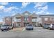 Apartment building with brick and siding, balconies, professional landscaping, and accessible parking at 411 Weather Ridge Ln # 45, Cary, NC 27513