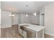 Kitchen island with a stainless steel sink, and stainless steel dishwasher at 411 Weather Ridge Ln # 45, Cary, NC 27513