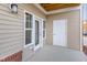 Covered patio featuring beige siding and white trim at 411 Weather Ridge Ln # 45, Cary, NC 27513