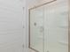 Walk-in shower with glass door and tile flooring at 411 Weather Ridge Ln # 45, Cary, NC 27513