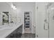 Stylish bathroom with double sinks, modern fixtures, and a glass-enclosed shower, complemented by sleek finishes at 5 Seawell Ave # 106, Raleigh, NC 27601