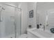 Well-lit bathroom with a sleek vanity, glass shower, and modern fixtures, creating a clean and functional space at 5 Seawell Ave # 106, Raleigh, NC 27601