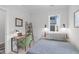 Comfortable bedroom with a desk, natural light, and neutral color palette for a relaxing atmosphere at 5 Seawell Ave # 106, Raleigh, NC 27601